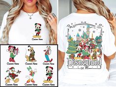 a woman wearing mickey mouse christmas t - shirt in front of a castle with disney characters on it