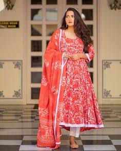 Red has always been the color of the fashion town! A masterpiece in itself, the dabu print and the white border at the hemline just add extra grace to the attire. Kurta - A dabu print cotton 6 meter Flair kali Kurta, white cotton lace on hem & length - 48 inch Pant - A semi-elasticated white cotton pant, length - 37 inch Dupatta - Dabu printed cotton dupatta with lace on all edges Color - Red Material- Cotton, Dabu Hand Print CARE: Dry clean & Quick deep wash only Shipping - 10-12 days. Red Traditional Kurta With Floral Print, Red Floral Print Kurta For Festivals, Red Floral Print Straight Kurta, Red Cotton Dress With Dupatta, Red Cotton Sets With Floral Print, Red Cotton Floral Print Sets, Red Floral Print Cotton Sets, Red Printed Kurta For Festive Occasions, Festive Red Printed Kurta