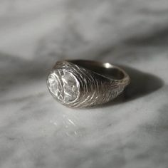 The MELT signet ring is hand carved from jewellers wax and cast using the ancient 'Lost Wax Casting' method and then hand finished to reveal this unique design that celebrates texture. Available in Eco sterling silver or brass. The silver MELT signet is hallmarked by the British Assay Office. This ring is designed as an homage to the centuries and millennia old goldsmith's skills that are still used to this day. In celebration of the hand made, this signet features an irregular file mark texture Symbolic Round Hand Cast Signet Ring, Hand Cast Antique Rings For Anniversary, Antique Hand-cast Signet Ring For Gift, Antique Hand Cast Signet Ring For Gift, Antique Hand Cast Rings For Anniversary, Heirloom Carved Sterling Silver Engraved Ring, Carved Sterling Silver Signet Ring, Antique Carved Sterling Silver Signet Ring, Silver Round Signet Ring With Intaglio