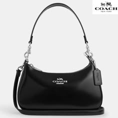 Coach Teri Shoulder Bag Spazzolato leather novelty leather/Silver/Black Color: Silver/Black Description     Spazzolato leather ·  Two credit card slots ·  Inside multifunction pocket ·  Zip-top closure, fabric lining ·  Detachable handle with 8 1/4" drop ·  Detachable strap with 22 3/4" (57,79см) drop for shoulder or crossbody wear ·  9 1/2" (L 24,13 см ) x 6" (H 15,24см) x 3" (W 7,62см) Black Silver Handbag, Coach Silver Bag, Coach Small Purse, Black Purse Silver Hardware, Coach Shoulder Bag Black, Eliza Shoulder Bag Coach, Coach Purses Black, Silver Coach Bag, Coach Teri Shoulder Bag Black