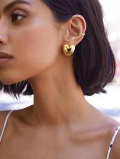 Sprinkle some love into your everyday outfits with the Laura Earrings — gold heart huggie earrings. Subtle, sweet, and oh-so-charming, these earrings pair well with almost anything for effortless styling. Chic Heart-shaped Everyday Earrings, Chic Everyday Heart-shaped Earrings, Trendy Gold Heart Earrings, Gold Heart-shaped Huggie Earrings For Everyday, Everyday Gold Heart Huggie Earrings, Everyday Gold Heart-shaped Huggie Earrings, Trendy Heart-shaped Yellow Gold Earrings, Chic Gold Heart Earrings For Everyday, Chic Everyday Gold Heart Earrings