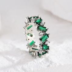 ✦ Make a bold and unique fashion statement with our Gold Plated Green CZ Ring. This stunning ring features a striking geometric design adorned with a captivating green CZ (Cubic Zirconia) stone. The combination of the vibrant green color and the lustrous gold plating creates an eye-catching contrast that is sure to turn heads. With its one-of-a-kind design, this ring is perfect for those who appreciate distinctive and unconventional jewelry. Whether you wear it as a standalone piece or pair it w Modern Green Cubic Zirconia Jewelry, Green Stone Jewelry For Promise Ring, Elegant Green Emerald Ring With Stones, Green Cubic Zirconia Crystal Promise Ring, Green Crystal Stone Ring For Anniversary, Green Crystal Ring With Stones For Anniversary, Green Gemstone Crystal Open Ring, Green Stone Fine Jewelry Rings, Fine Jewelry Green Rings With Stones