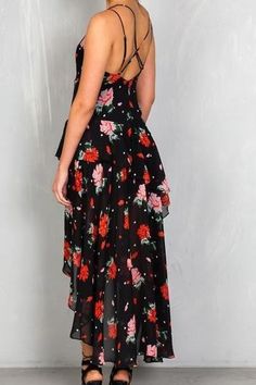 Our Floral Tiered Ruffle High-Lo Maxi Dress is a bestseller! Perfectly draped and flowy, this dress is great for weddings, date nights, parties, or vacation. This dress is sure to stun and get lots of compliments with its criss-cross adjustable straps, high-low hem with subtle ruffles, and beautiful red and black floral print! This dress is a bestseller! Don't wait for it to sell out! Hi-low hem with slight ruffle Criss-cross adjustable straps Back zip closure with hook & eye Lined 100% Poly Flirty Tiered Maxi Dress For Summer, Summer Tiered Maxi Dress For Party, Floral Print Chiffon Dress For Date Night, Flirty Tiered Maxi Dress For Brunch, Chiffon Sundress Maxi Dress With Ruffles, Flirty Summer Maxi Dress For Garden Party, Flirty Tiered Maxi Dress For Garden Party, Flirty Maxi Dress For Summer Garden Party, Chiffon Ruffled Sundress Maxi