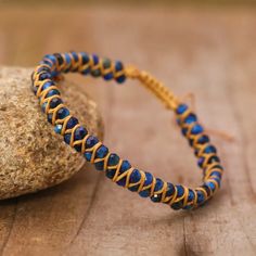 Indulge in the timeless beauty of the Blue Tiger Eye Boho Faceted Crystal Bead Woven Bracelet. Made with expert craftsmanship and high-quality natural stones, this stunning bracelet effortlessly exudes style and sophistication. The intricate weaving of the blue tiger eye beads create a unique and eye-catching texture. The natural stone of the tiger eye exudes an elegant sheen that perfectly contrasts the subtle sparkle of the crystal beads. This exquisite piece of jewelry is not just stylish, bu Bohemian Lapis Lazuli Beaded Bracelets With Natural Stones, Bohemian Beaded Bracelets With Lapis Lazuli Stones, Bohemian Beaded Bracelets With Lapis Lazuli, Adjustable Lapis Lazuli Beaded Bracelets Bohemian Style, Bohemian Lapis Lazuli Beaded Bracelets, Blue Spiritual Braided Bracelets Hand-strung, Spiritual Sapphire Beaded Bracelets Hand-strung, Hand-strung Sapphire Beaded Bracelets, Spiritual Sapphire Beaded Hand-strung Bracelet