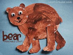 a brown bear made out of paper on a blue background