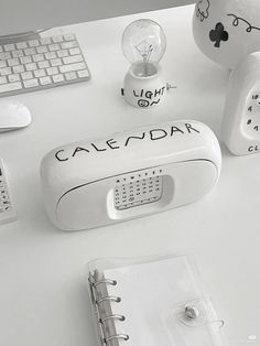 a white desk with various items on it