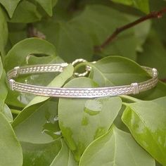 A pretty little bracelet of four strands of sterling silver wire--two twist in the middle and two plain square on either side. Understated, elegant, and affordable. Stackable, too...several wirewrapped braclets altogether look terrific! The sturdy built-in hook and eye clasp is easy to get on and off by yourself. Choose your size for a perfect custom fit! Add on a jewelry polishing cloth to keep your bracelet--and ALL your jewelry--shiny clean! https://www.etsy.com/listing/732310828/jewelry-poli Adjustable Bangle Bracelet With Sterling Silver Clasp, Silver Sliding Knot Bangle Bracelets, Silver Sliding Knot Bangle Bracelet, Silver Braided Bangle Bracelet For Friendship, Silver Bangle Bracelet With Sliding Knot, Silver Hand Wrapped Bracelets For Friendship, Classic Adjustable Braided Bangle Bracelet, Adjustable Sterling Silver Braided Bracelet, Nickel-free, Adjustable Braided Bangle Bracelet With Sterling Silver Clasp