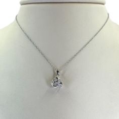 14 Karat Gold Love Knot Pendant Necklace Featuring 0.06 Carat Total Weight Round Diamonds of I1 Clarity and H/I Color. 16 Inches Long. Style KNOT. Available in white or yellow gold. Diamond Knot Necklace, Diamond Knot, Love Knot, Knot Necklace, Long Style, Round Diamonds, Knot, Diamonds, White Gold