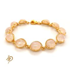 Effective Bracelet with Genuine Moonstone It is made of gold-plated 925 silver (Ag 925) We are plating our Goods with a thick layer of gold, therefore You can be satisfied with quality for ages. Standard length of this bracelet is around 18,5 cm, but there is a possibility to make it a little bit longer (up to 21 cm) because of the chain we put in the end. Bracelet is made of individual elements made of silver gold-plated and Moonstone. Cabochons measurements are 8x10 mm. Each of them may appear Spiritual Gold Bracelets With Moonstone, Adjustable Gold Moonstone Bracelet, Gold Moonstone Round Bracelets, Gold Moonstone Gemstone Bracelets, Gold Moonstone Bracelet With Gemstones, Yellow Gold Cabochon Bracelet As Gift, Gold Bracelets With Rose Quartz And Natural Stones, Gold Gemstone Crystal Bracelet, Minimalist Gold Bracelets With Gemstones