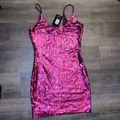 Fashion Nova Pink Glitter Dress Size Large Perfect For Your Next Party! Spring Night Out Sequin Shimmer Fabric, Spring Night Out Sequin Fabric With Shimmer, Spring Sequin Fabric For Night Out With Shimmer, Party-ready Fitted Mini Dress With Glitter, Spring Party Sequin Glitter Fabric, Spring Party Sequin Fabric With Glitter, Summer Sparkling Bodycon Dress For Night Out, Sparkling Bodycon Dress For Party Season, Glitter Bodycon Dress For Prom And Party Season