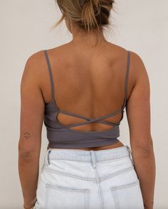 ~ 72% Modal 24% Nylon 4% Spandex ~ Seamless ~ Open back criss cross straps ~ Model is 5'9" wearing a size S/M Fitted Crisscross Crop Top With Built-in Bra, Seamless Stretch Backless Tops, Fitted Tank Top With Built-in Bra And Strappy Back, Backless Stretch Tank Top, Stretch Backless Tank Top With Straps, High Stretch Tops With Built-in Bra And Cross Back, Fitted Strappy Back Crop Top, Fitted Straps With Built-in Bra, Backless Stretch Camisole With Straps