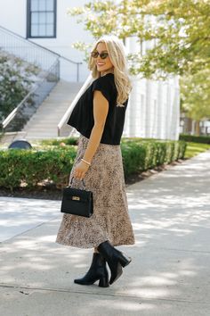 Add a touch of wild flair to your wardrobe with the Brown Leopard Print Midi Skirt! This effortlessly stylish piece combines bold print with a flattering fit, making it perfect for any boho-chic look. Designed with a lightweight fabric, this skirt offers comfort and flow, making it ideal for all-day wear. Pair this skirt with a simple tank, graphic tee, or your favorite cozy sweater for a versatile style that transitions seamlessly from day to night. Chic Flowy Rayon Maxi Skirt, Chic Relaxed Fit Maxi Skirt In Rayon, Chic Relaxed Maxi Skirt In Rayon, Rayon Tiered Maxi Skirt For Day Out, Rayon Skirt With Floral Print For Day Out, Rayon Floral Print Skirt For Day Out, Floral Print Rayon Skirt For Day Out, Chic Flared Maxi Skirt In Rayon, Chic Rayon Tiered Maxi Skirt