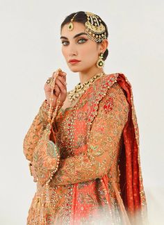 Farshi Lehenga Frock Dupatta Pakistani Bridal Dress is a heavily embellished attire that will give you a head-turning look on the big day. This stunning Pakistani Wedding Dress is adorned with embroidery, zari, and goldwork. Farshi Lehenga, Lehenga Frock, Red Saree Wedding, Bridal Lehenga Pakistani, Nameera By Farooq, Net Design, Dresses Pakistani, Coral Fabric, Dress With Embroidery