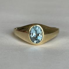 Exquisite Mid Century 14K Ladies Men's Light Blue Topaz Ring, Size 12.25, 6.7 grams, December Birthstone Size: 12.25 Weight: 6.7 grams Stones: Blue Topaz Size Stone: ca. 9.5mm x 7mm Color Gemstone: Light Blue Number of Gemstones: 1 Markings: 14K Band Width: Tapers from ca 1.9mm to 10.5mm  Material: 14K Yellow Gold Condition: Very good preowned, usage throughout -refer to pictures for condition. All jewelry will be professionally cleaned before shipping and come in a beautiful little gift box. Re Formal Blue Topaz Gemstone Signet Ring, Classic Anniversary Topaz Birthstone Ring, Formal Blue Topaz Signet Ring, Formal Yellow Gold Signet Ring With Birthstone, Classic Gold Rings With Blue Topaz, Blue Topaz Gemstone Signet Ring Gift, Classic Blue Topaz Ring With Polished Finish, Classic Gold Blue Topaz Birthstone Ring, Classic Blue Topaz Ring For Formal Occasions