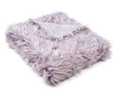 a fluffy purple blanket on a white background