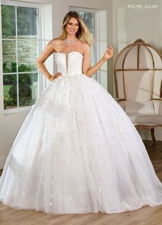 a woman in a wedding dress posing for the camera