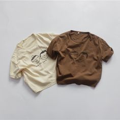 Basic Summer T-shirt, Trendy Brown Relaxed Fit T-shirt, Cute Brown Crew Neck T-shirt, Beige Letter Print T-shirt For Spring, Casual Brown Organic Cotton Tops, Brown Cotton Printed Tops, Trendy Beige Relaxed Fit T-shirt, Oversized Brown Cotton T-shirt, Trendy Brown T-shirt For Spring