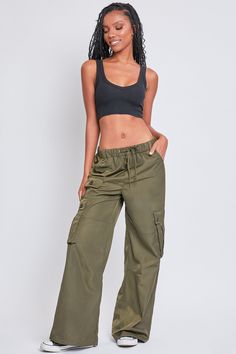 Every day is a new chance to wear our Women’s Relaxed Fit Cargo Pants. This high-waisted nylon pant features a relaxed fit for both style and comfort, ensuring you’ll look good and feel good throughout the day. Includes classic front pockets, three cargo pockets with button closures, and faux back pockets for maintaining a smoothing effect on your bum. These trendy pants are detailed with metal d-rings on the front belt loops and a drawstring waist so you can adjust the fit to your liking. Style Trendy Straight Leg Parachute Pants With Elastic Waistband, Versatile High Waist Parachute Pants With Relaxed Fit, Trendy Parachute Pants With Elastic Waistband And Straight Leg, Sporty High Waist Parachute Pants With Pockets, Athleisure Full Length Parachute Pants With Pockets, High Waist Khaki Parachute Pants, Athleisure Wide Leg Cargo Bottoms, Casual High Waist Parachute Pants With Relaxed Fit, Casual High Waist Relaxed Fit Parachute Pants