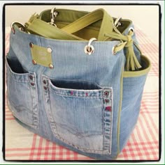 a denim purse with two pockets on the inside