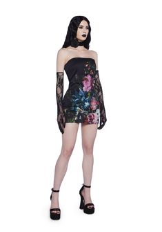 This dress has a stretchy twill construction, floral print on the front and back, inner rubber tape at the top for a non-slip fit, and a side hook & eye zipper closure. Spring Gothic Bodycon Dress, Gothic Bodycon Mini Dress For Spring, Evening Stretch Mini Dress With Floral Print, Floral Print Bodycon Dress For Club, Bodycon Floral Print Dress For Club, Fitted Floral Print Club Dress, Alternative Dresses For Night Out In Spring, Spring Alternative Dresses For Night Out, Alternative Style Spring Dresses For Night Out