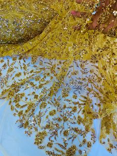 gold sequins and beading on blue fabric