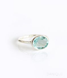 You'll fall in love with the light blue color of this Blue Topaz Quartz ring. This is a perfectly sized oval to compliment any collection. Popular as a birthday gift for those December babes and Blue Topaz lovers alike. This is a pale, transparent blue gemstone with no flaws. This stone is beautifully faceted and bezel set in a 925 sterling silver band or plated with 18k vermeil gold. Gemstone is approximately 8 x 12mm. Band has 925 stamp on inside. Please note that each ring is handmade and the Luxury Blue Birthstone Ring With Bezel Setting, Oval Aquamarine Birthstone Ring As Gift, Oval Aquamarine Birthstone Ring For Gift, Turquoise Oval Topaz Ring For Gift, Oval Turquoise Topaz Ring As Gift, Oval Turquoise Topaz Ring For Gift, December Birthday Gifts, December Birthstone Jewelry, December Birthstone Ring