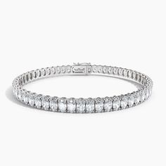 Elegant and so unique, this diamond tennis bracelet features oval shaped diamonds, set in the classic 4-prong setting that hugs each diamond. This stunning oval diamond bracelet sparkles in the simple yet gorgeous setting, creating sparkle with every movement. The 11CTW diamond bracelet is a luxe style and luxurious fashion statement. Black Diamond Pendant, Black Diamond Studs, Halo Diamond Earrings, Solitaire Diamond Pendant, Colored Diamond Rings, Luxurious Fashion, Luxe Style, Halo Earrings, Diamond Tennis Bracelet