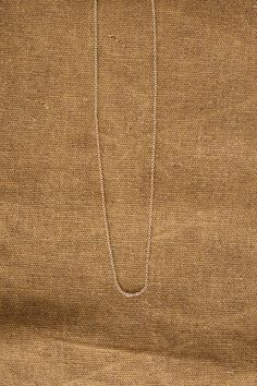 Delicate and simple chain necklace 14K Yellow Gold 16" Spring clasp .5mm width Handle with care Made in California Designer: Kathleen Whitaker | Learn more about the Designer and shop the collection. Classic Rose Gold Chain Necklace With Delicate Chain, Classic Delicate Rose Gold Chain Necklace, Classic Rose Gold Delicate Chain Necklace, Delicate White Gold Cable Chain Necklace, 14k Gold Silver Chain Necklace With Delicate Chain, 14k Gold Delicate Chain Necklace In Silver, 14k Gold Delicate Silver Chain Necklace, Classic Rose Gold Charm Necklace With Delicate Chain, Delicate 14k White Gold Chain Necklace