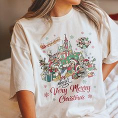 Disney Graphic Print T-shirt For Holiday, Disney Christmas Holiday Tops, Christmas Disney Holiday Top, Disney Christmas Holiday Top, White Christmas T-shirt With Character Print, White Christmas Character Print T-shirt, Disney Christmas Cotton Top, Disney White Christmas Tops, Disney Cotton Christmas Tops