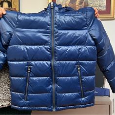 Warm And Lightweight Puffer Jacket From Guess Brand Medium Blue Jacket New With Tag On Outdoor Blue Hooded Jacket With Zipper Closure, Blue Hooded Jacket With Zipper For Outdoor, Blue Down Puffer Jacket With Detachable Hood, Blue Hooded Outerwear For Outdoor, Blue Hooded Outdoor Outerwear, Blue Weatherproof Hooded Jacket For Fall, Winter Outerwear With Zipper Closure In Blue, Blue Winter Outerwear With Zipper Closure, Blue Long Sleeve Parka With Fleece Lining