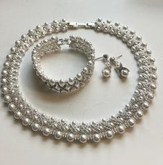 Finished in silver tone signed. Genuine Swarovski crystal. "Made in the USA"  Comes with pouch, Romance card  and Certificate of Authenticity Bracelet And Earring Set, Bib Necklaces, Pearl Crystal, Certificate Of Authenticity, Necklace Bracelet, Arm Band, Swarovski Crystal, Crystal Necklace, Faux Pearl