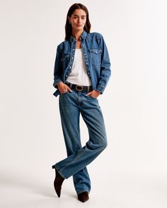 On-trend shirt in a soft denim fabric and relaxed-fit silhouette, with classic collar, chest pockets with snap closure, snap-up front and curved hem. Womens Denim Shirt, Western Denim Shirt, Trending Shirts, Denim Fabric, New Arrival Dress, Denim Shirt, Swimwear Accessories, Button Up Shirts, Shirt Blouses