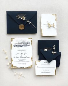 the wedding stationery was done in navy and gold