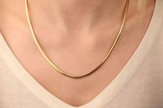 Our snake chain necklace is 14k solid gold. With its minimalist style, you can wear it every day and it fits your all outfit. It is a modern and trendy necklace.  It looks very stylish both alone and when combined with other necklaces. If you consider this gold snake chain as a gift, it makes your loves happy on their birthdays, anniversaries, graduations, mother's day, valentine's day, or women's day. 🎁 We can add a gift note for your loved ones. It arrives in a special jewelry gift box.  ✨ We respond to your questions happily. Your question will be answered within 24 hours. Do not hesitate to contact us. 💎 I hope you have a lot of Onseva's designs. :) lzm Minimalist Snake Chain Necklace For Anniversary, Modern Yellow Gold Herringbone Necklace As Gift, Minimalist Herringbone Necklace With Box Chain As Gift, Minimalist 14k Gold Snake Chain Necklace Gift, Modern Yellow Gold Snake Chain Necklace As Gift, Classic 14k Gold Snake Chain Necklace As A Gift, Classic 14k Gold Snake Chain Necklace For Gift, Minimalist Yellow Gold Herringbone Necklace For Formal Occasions, 14k Gold Box Chain Herringbone Necklace For Gift