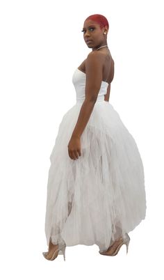 Beautifully designed, this flirty strapless off white dress features a smooth fabric body suite paired, sweetheart neckline, and a layered tulle skirt. Includes zip enclosure on the back. Model is wearing a size small. Fitted Tulle Strapless Dress, Strapless Dresses With Fitted Bodice In Tulle, Strapless Tulle Dress With Sheer Bodice, Strapless Tulle Dress With Boned Bodice, Tulle Strapless Dress For Prom Season, Strapless Tulle Dress For Prom Season, Tulle Strapless Dress For Prom, Fitted Tulle Strapless Dress With Corset Back, Strapless Tulle Evening Dress For Prom