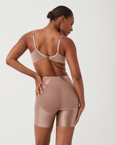 Get an instant butt lift in this shaping short designed specifically to naturally enhance and lift your behind. | Spanx Women's SPANXshape Booty-Lifting Mid-Thigh Shorts Supportive Shapewear With Built-in Bra, Short Length, Supportive Shapewear Shorts With Built-in Bra, Supportive Short-length Shapewear With Built-in Bra, Supportive Full Coverage Shapewear With Built-in Shorts, Compression Shapewear With Built-in Bra And Short Leg, Full Coverage Smoothing Shapewear Shorts, Shapewear Shorts With Full Coverage, Compressive Shapewear With Built-in Bra And Short Leg, Shapewear With Medium Bust Support, Short Style