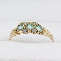 George V 15ct yellow gold Ring set with emerald and split pearls, Marked Birmingham 1921 JP Size Q - Can be resized Emerald Stone Ring, Emerald Stone Rings, Bakelite Bangles, Ring Emerald, Gold Ring Sets, Gold Ribbons, Emerald Stone, Yellow Gold Ring, Stone Ring