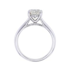 a white gold engagement ring with an oval cut diamond