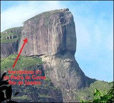 a tall mountain towering over a lush green forest