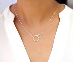 Looking for the perfect accessory to go with your New Years Eve outfit? Look no further! Ring in the new year with my Interlocking Rings Necklace. It's the perfect accessory for that fabulous party outfit I know you're planning. 🥳 14k Gold Initial Necklace, Double Circle Necklace, Interlocking Circle Necklace, Initial Necklace Silver, Necklace Outfit, Sister Necklace, Long Silver Necklace, Initial Necklace Gold, Circle Pendant Necklace