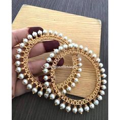 Very beautiful high quality pearl bangles with golden polish polish. It will come in a pair ( 2 bangles). Indian Jewelry Traditional, Pearl Bangles Gold, Jaipur Jewelry, Pearl Bangles, Temple Jewellery Earrings, Jewelry Traditional, Gold Pearl Jewelry, Fancy Jewelry Necklace, Bridal Jewelry Vintage