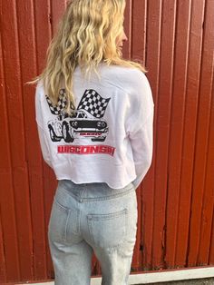 Experience the ultimate in comfort and style with our women's white cropped sweatshirt! Featuring a raw hemline, this pullover is perfect for showing off your love for the Wisconsin Race Team. Get ready to turn heads and make a statement with this must-have design. Cropped Pullover, Pullover Sweatshirt, Wisconsin, Sweatshirts, White