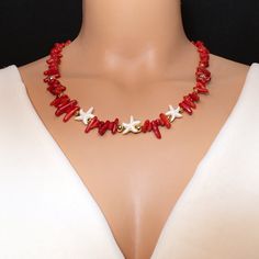 Welcome to the epitome of summer elegance! Dive into the depths of ocean-inspired beauty with our Handmade Red Coral Summer Necklace, adorned with exquisite star mother of pearl accents and finished with a touch of luxury in its 24k yellow Gold Plated clasp and balls. Crafted with love and meticulous attention to detail, this necklace captures the essence of summer in every delicate curve and vibrant hue. The centerpiece, a stunning red coral gemstone, exudes warmth and vitality, reminiscent of Luxury Red Coral Gemstone Necklace, Elegant Starfish Charm Jewelry For Vacation, Elegant Starfish Shaped Jewelry For Vacation, Elegant Starfish Jewelry For Vacation, Ocean-inspired Starfish Shell Necklace As Gift, Ocean-inspired Starfish Shell Necklace, Gold Spiritual Jewelry For Vacation, White Starfish Shell Necklace As A Gift, Starfish Shell Jewelry