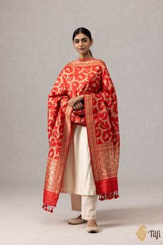 "A stunning red\u00a0handloom\u00a0masterpiece\u00a0in an exquisite Shikaargah design, featuring a\u00a0beautiful\u00a0web of zari, figures and animal motifs crafted in zari.\u00a0\n\u00a0\n\n\n\nColor\u00a0-\u00a0A ravishing\u00a0shade of\u00a0Red\n\n\n Technique\u00a0-\u00a0Classic handwoven Banarasi art passed down through generations of weaving traditions and an enduring Kadwa weave. The elaborate and laborious Kadwa (Kadhua) technique involves hand-weaving each motif separately. It takes longer on the handloom, but makes a more robust pattern which stands out on the fabric.\u00a0\n\n\n Fabric\u00a0- Soft as butter, pure Katan silk\n\n Speciality\u00a0- A luxurious drape, an opulent zari jaal, and incredibly detailed animal motifs in the finest Kadhua weave.\u00a0\n\n Tilfi Promise\u00 Jungle Scene, Animal Motifs, Katan Silk, Flora And Fauna, Vines, Things To Wear, Hand Weaving, Saree, Birds