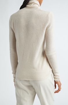 Supremely soft cashmere warms a fitted sweater knit in Italy with a tall turtleneck and deeply ribbed trim. Turtleneck Long sleeves Ribbed cuffs and hem 100% cashmere Dry clean Made in Italy Designer Clothing Cream Textured Cashmere Sweater, Cashmere Turtleneck Soft Knit Top, Ribbed Funnel Neck Cashmere Sweater, Long Sleeve Cashmere Soft Knit Turtleneck, Soft Knit Long-sleeve Cashmere Outerwear, Cashmere Turtleneck, Fabric Gift Bags, Nordstrom Store, Fitted Sweater