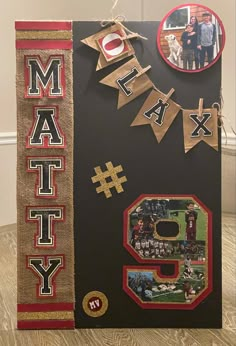 a black and red photo frame with the number nine on it's side, decorated with letters that spell out