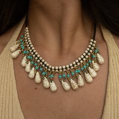 ⭐ Unique Boho Design » Our women's jewelry is characterized by a black band, adorned at the neck with dangling turquoise and golden beads. At each end of the women's bead necklace, there are small white healing stones that provide a fascinating eye-catcher. ⭐ Perfect Length and Width » The surfer necklace is 45 cm long and has a width of 4 cm at the neck, making this women's necklace ideal for achieving a striking statement look. The healing stone necklace is the centerpiece for any Hawaiian wom Bohemian Black Beaded Dangle Necklaces, Bohemian Dangle Turquoise Necklace With Adjustable Fit, Hippie Jewelry With Dangling Beads, Bohemian Turquoise Jewelry Fair Trade, Bohemian Turquoise Jewelry, Fair Trade, Bohemian Turquoise Fair Trade Jewelry, Turquoise Bohemian Fair Trade Jewelry, Bohemian Black Beaded Dangle Jewelry, Turquoise Jewelry With Black Beads For Festival