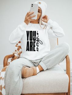 Our designs are pressed onto soft, unisex fitting apparel. Ideas For T Shirts Print, Tshirts Prints Ideas, Quotes On T-shirts, Shirt With Sayings, Sweater Designs For Women Vinyl, You Are Enough Sweatshirt, Creative Shirt Design Ideas, Popular Tshirt Designs Shirt Ideas, You Are Enough Shirt