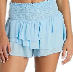 Chic Blue Tiered Bottoms, Tiered Ruffle Bottoms For Day Out, Summer Beach Bottoms With Ruffle Hem, Blue Ruffled Short Bottoms, Light Blue Ruffled Mini Skirt, Blue High-waist Shorts With Ruffles, High Waist Blue Shorts With Ruffles, Light Blue Ruffled Skirt Bottoms For Summer, Blue Tiered Bottoms With Ruffle Hem