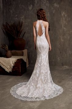 a woman in a wedding dress looking back